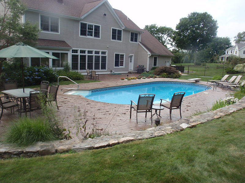Swimming pool and stamped concrete project example 56